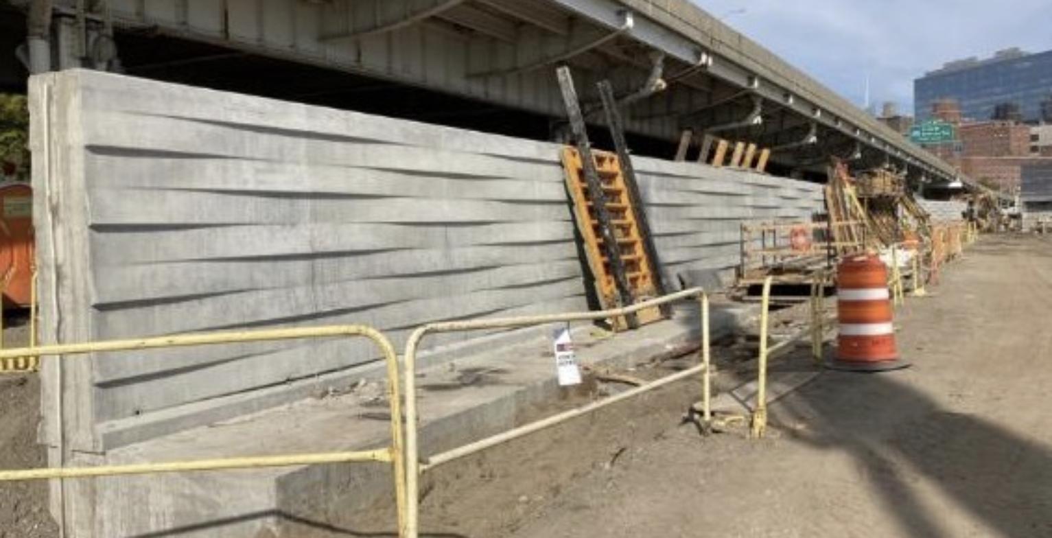 New concrete floodwall under construction along the East River in Manhattan, part of New York's coastal resiliency project