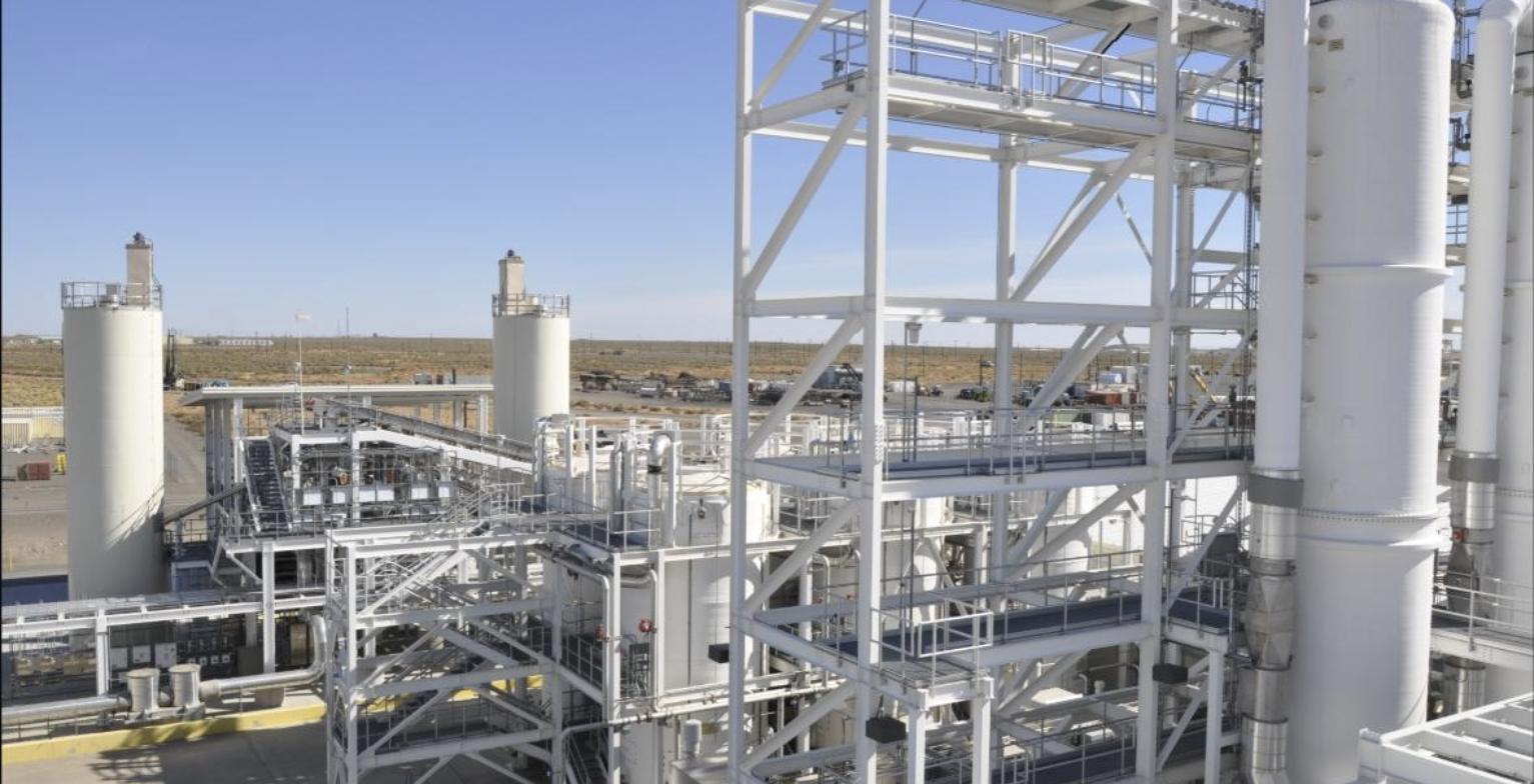 Waste treatment facility with tall steel structures and storage tanks at the Hanford Site in Washington state